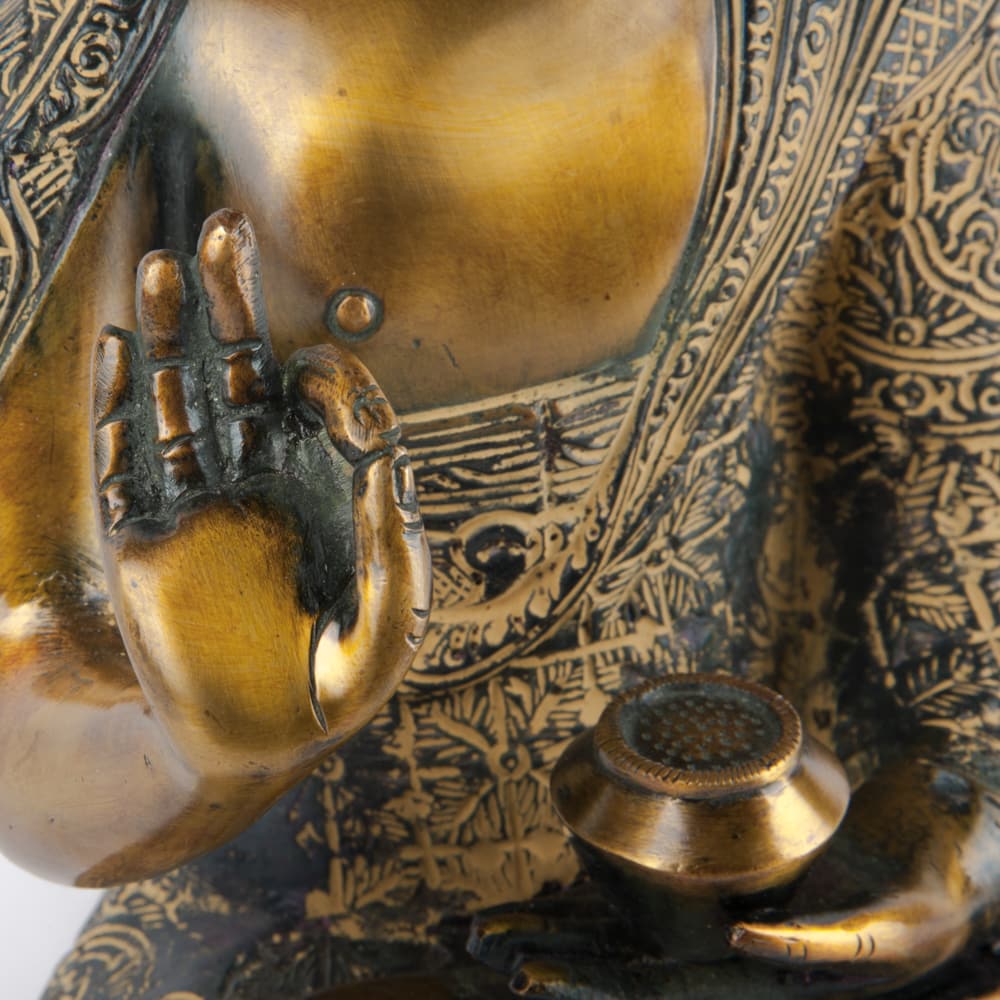 boeddha meditatie goud hand detail